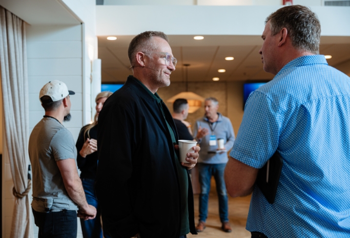 Mark Neal talking with leaders at a Clarity event